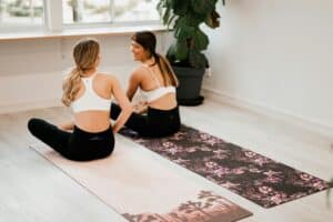 Two friends doing yoga together